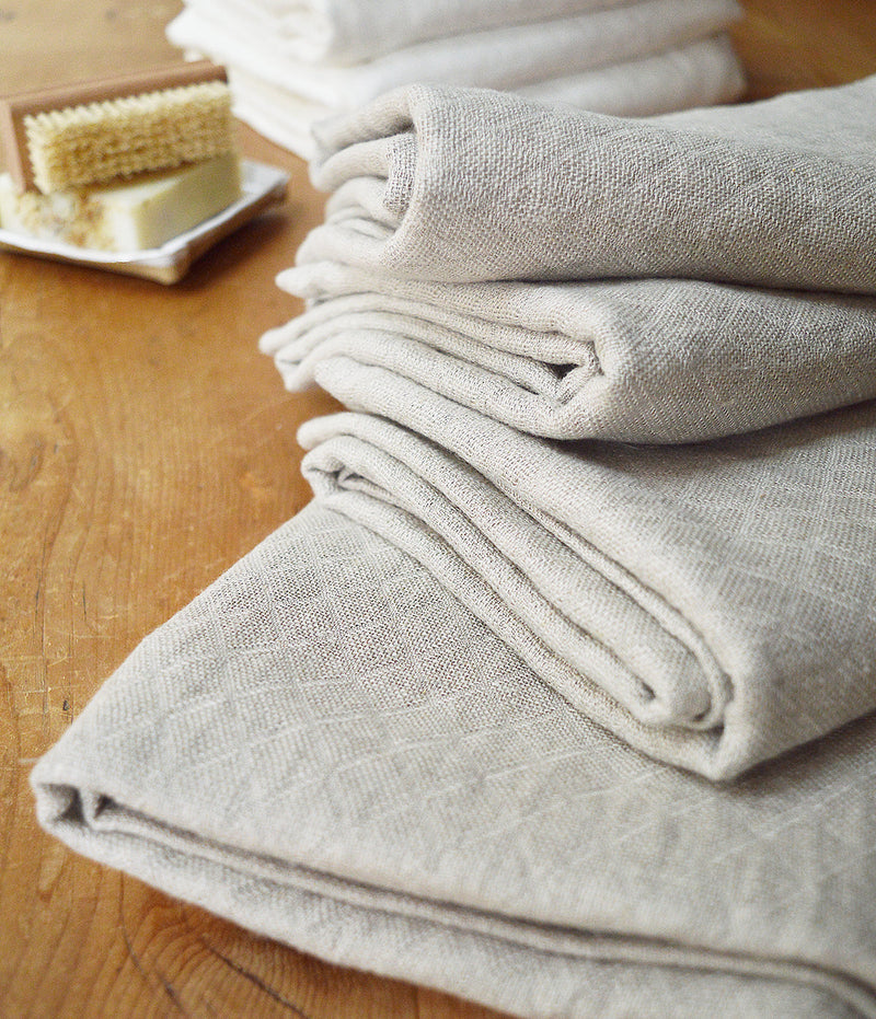 Wonderfully textured for gentle exfoliation and maximum absorbency, these quick-drying and durable diamond weave  towels are  woven from two layers of medium-weight, undyed 100% linen yarns. Whitened without the use of chlorine bleach.  Towels will arrive pressed and take on a quilted appearance after machine wash and dry, becoming softer with use.  For greater exfoliation, hang to dry.