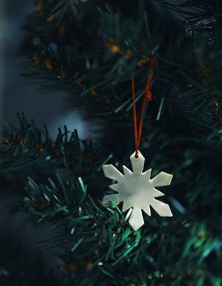 Fog Linen brass snowflake ornament. Shop Boston