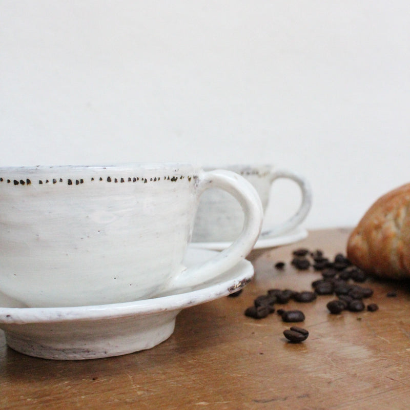 Handmade cup and saucer with dots. Shop Boston