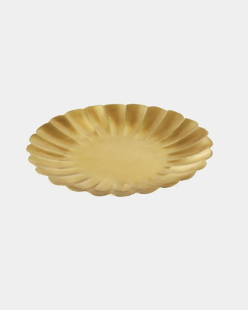 brass plate with scalloped edge on a white background.

Fog Linen round petal brass plate tray dish serving catch all home decor kitchen Boston gift shop store boutique