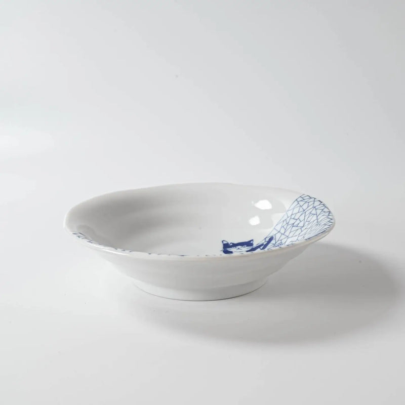 White ceramic bowl with blue decorative edge on a white background
