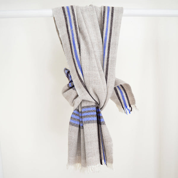 Super soft, 100% cotton khadi (homespun yarn and handwoven) throws in gorgeous plaid patterns. Made in India, these soft throws are perfect for cozying up this fall and winter while the bright colors make it a perfect throw to display year-round.  Choose from a pop of blue or  neutral white detailing. Made in India.