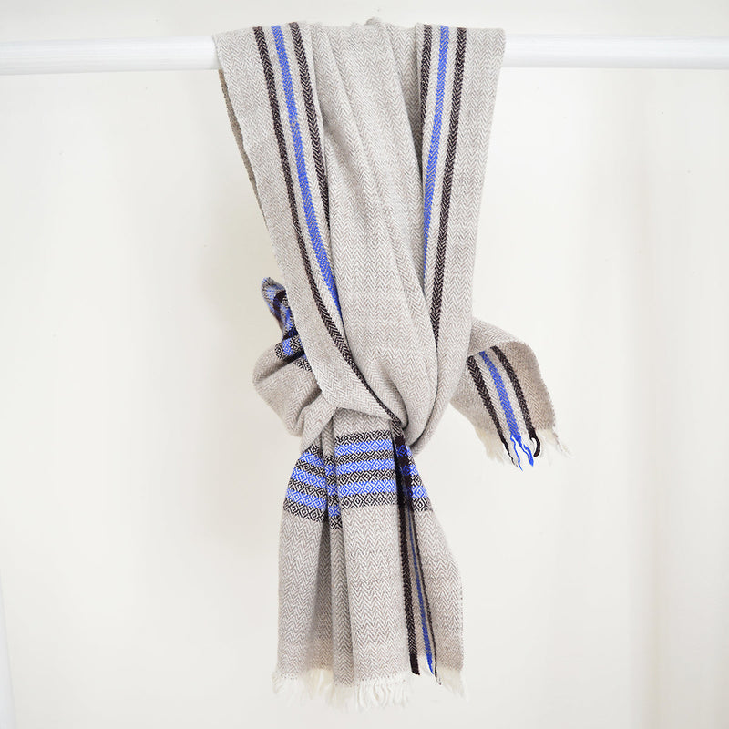 Super soft, 100% cotton khadi (homespun yarn and handwoven) throws in gorgeous plaid patterns. Made in India, these soft throws are perfect for cozying up this fall and winter while the bright colors make it a perfect throw to display year-round.  Choose from a pop of blue or  neutral white detailing. Made in India.