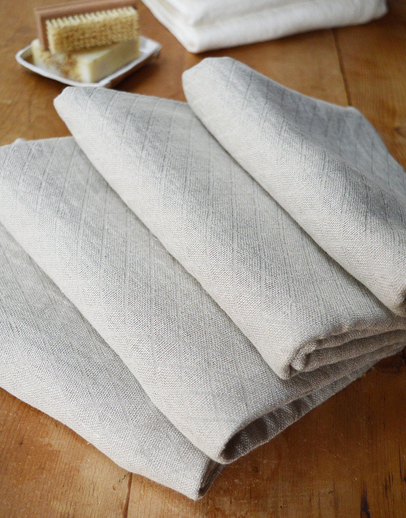 Wonderfully textured for gentle exfoliation and maximum absorbency, these quick-drying and durable diamond weave  towels are  woven from two layers of medium-weight, undyed 100% linen yarns. Whitened without the use of chlorine bleach.  Towels will arrive pressed and take on a quilted appearance after machine wash and dry, becoming softer with use.  For greater exfoliation, hang to dry.