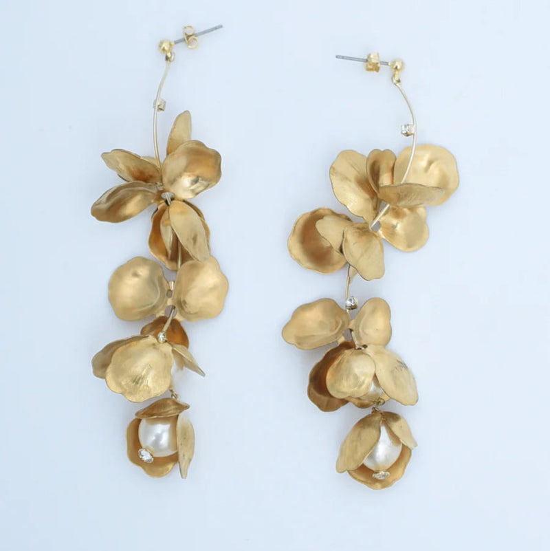 Long chandelier earrings with hanging brass petals and pearl accents 