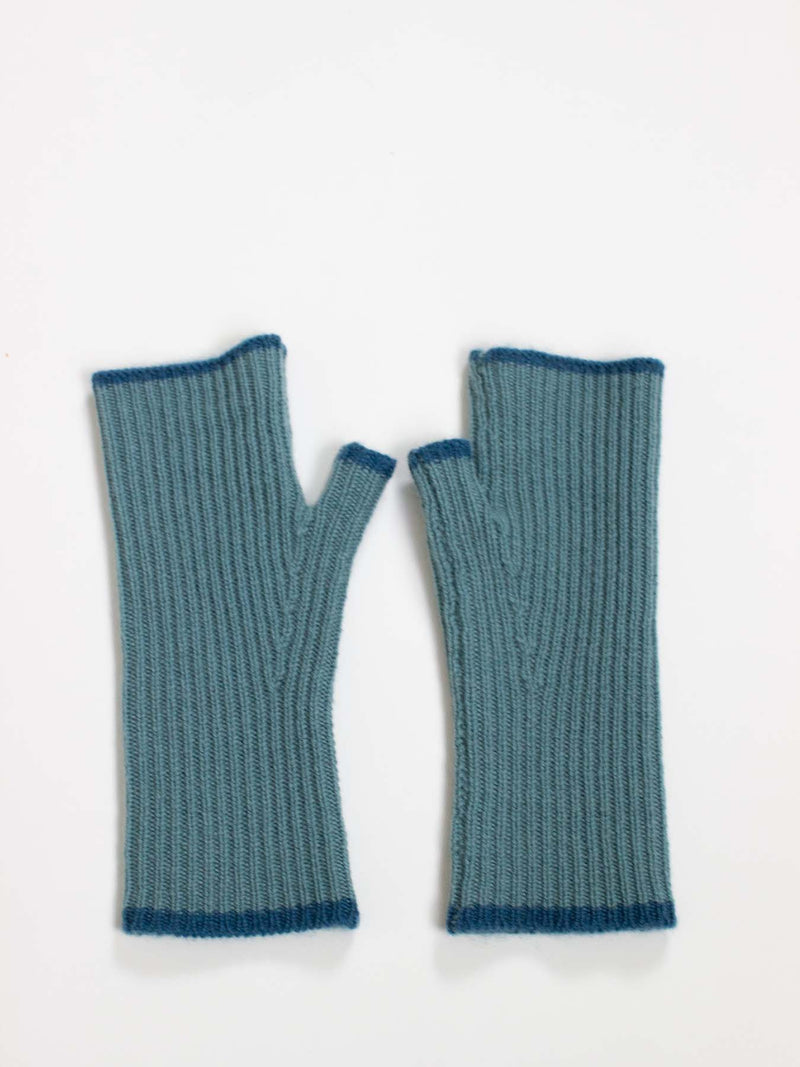 Pair of blue knitted fingerless gloves on a white background