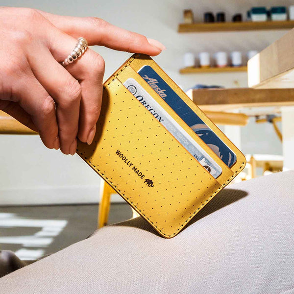 Yellow wallet with card holder held by a hand, with a blurred indoor background.

Wooly Made cardholder handmade leather small wallet sowa boston small business gift shop boutique gifts for him unisex