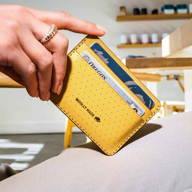 Yellow wallet with card holder held by a hand, with a blurred indoor background.

Wooly Made cardholder handmade leather small wallet sowa boston small business gift shop boutique gifts for him unisex