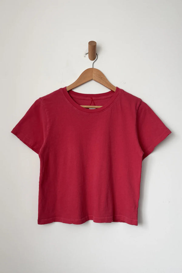 Le Bon Shoppe Darling T shirt in Red Pepper on a wooden hanger against a white background