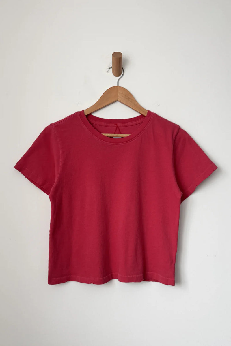 Le Bon Shoppe Darling T shirt in Red Pepper on a wooden hanger against a white background