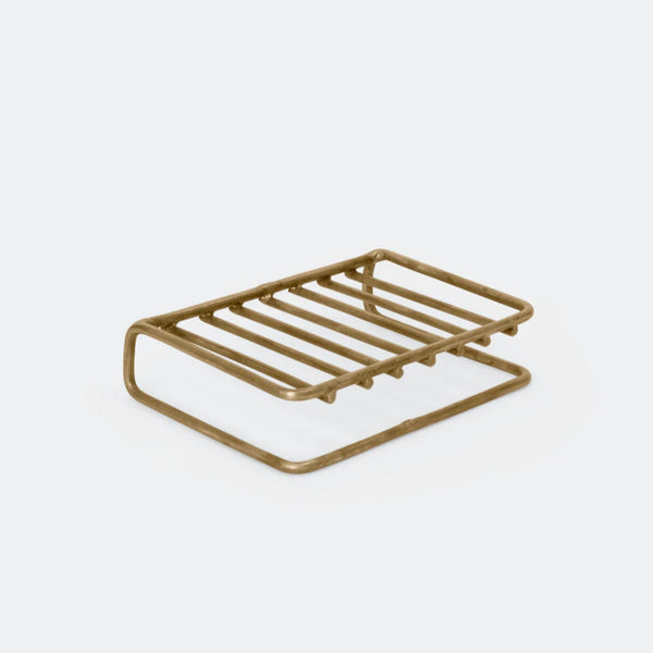 Brass metal soap dish on a white background.

Fog Linen brass bar soap stand bath shower home decor kitchen Boston gift shop store boutique