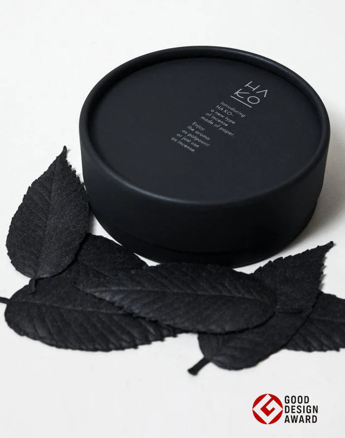 Black container with paper incense leaves on a white background, featuring the Good Design Award logo.

HA KO Paper Incense Gift Box Set of 6. Black No. 1 Relax Scents Home Fragrance Decor Made in Japan Shop SoWa Boston boutique
