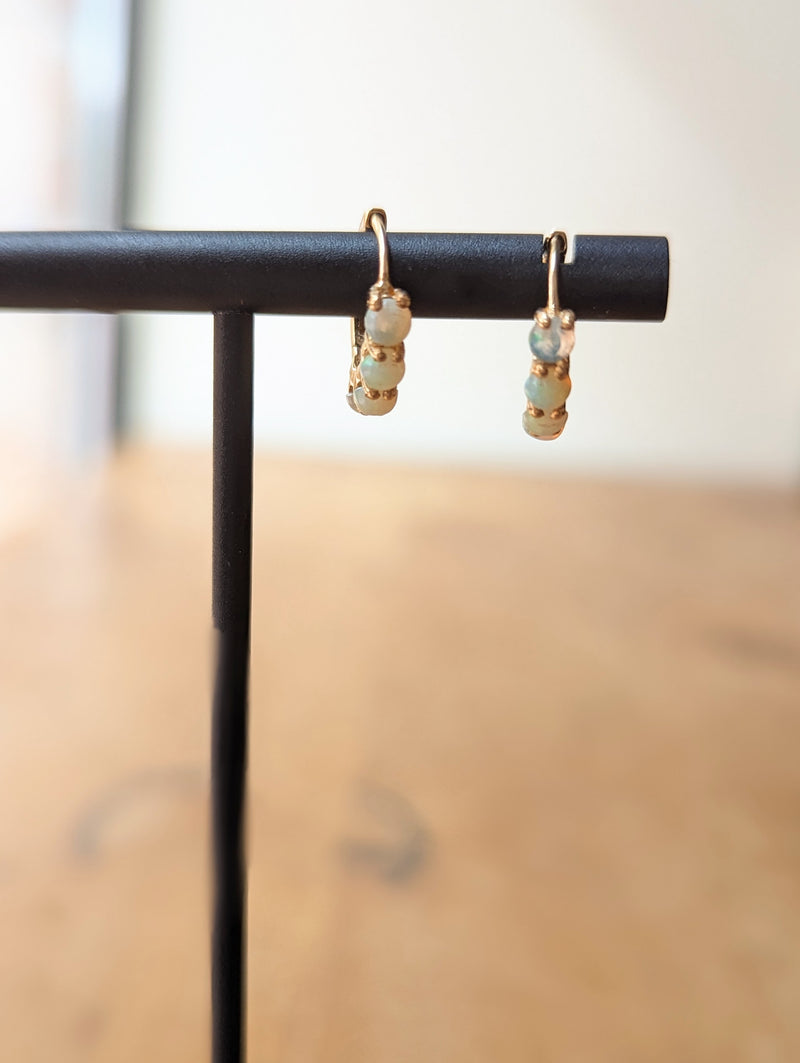 Small Australian opals set in 14k gold hoops jewelry store sowa gift shop fine handmade jewelry