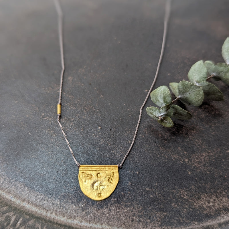 Hand-stamped talisman necklace River Song jewelry shop boston sowa gift shop gold 24k boutique