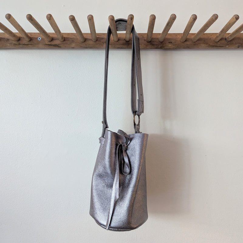 Stitch and Tickle handmade leather cinched bucket bag made in Boston made in usa leatherwork leathercraft SoWa boutique gift shop