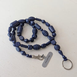 Blue beaded lanyard with a key ring on a white background. Ina Seifart Handikette Phone  Necklace   Bunter Mix  Blueberry wood gift shop sowa boston fashion accessories independent boutique lanyard keychain