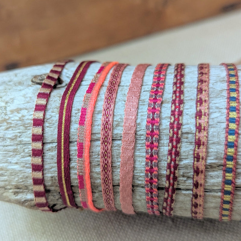 Set of colorful woven bracelets on a wooden log

Guanabana woven bracelet jewelry store sowa boston gift shop small business boutique small gifts for her 