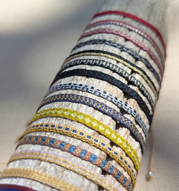 Close-up of woven bracelets with multicolored patterns on a neutral background

Guanabana woven bracelet jewelry store sowa boston gift shop small business boutique small gifts for her 