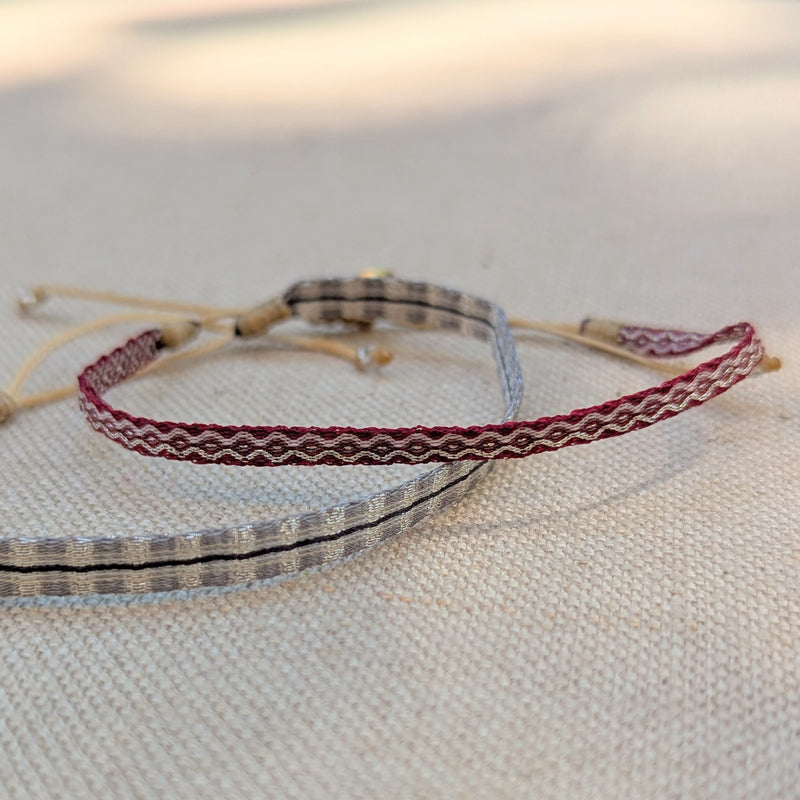 Bracelets with braided design on a textured fabric background

Guanabana woven bracelet handmade jewelry store sowa boston gift shop small business boutique small gifts for her unisex
