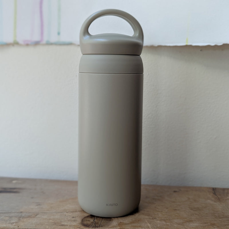 Gray insulated bottle with handle on a wooden surface

Japanese KINTO day off tumbler metal water bottle thermos insulated sowa Boston gift shop boutique store