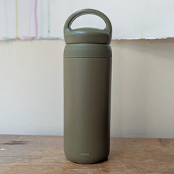 Green insulated bottle with handle on a wooden surface

Japanese KINTO day off tumbler metal water bottle thermos insulated sowa Boston gift shop boutique store