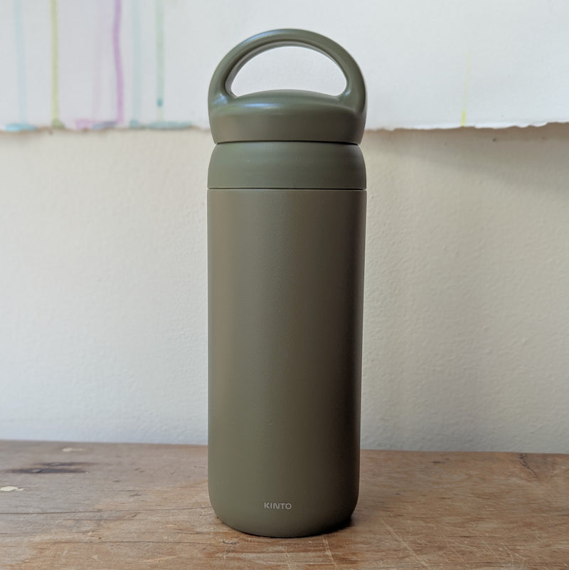 Green insulated bottle with handle on a wooden surface

Japanese KINTO day off tumbler metal water bottle thermos insulated sowa Boston gift shop boutique store