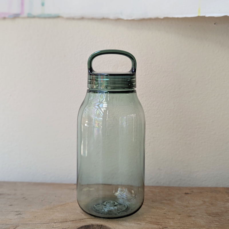 Clear green plastic water bottle on a wooden surface.

Japanese water bottles plastic travel portable clear transparent BPA free KINTO sowa Boston gift shop boutique store