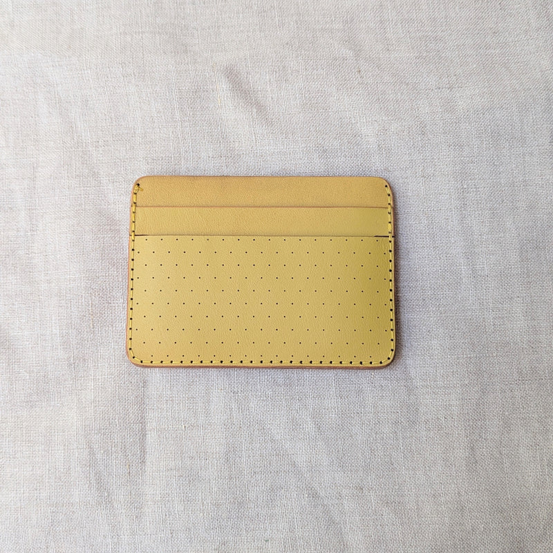 Yellow cardholder on a light gray fabric background

Wooly Made cardholder handmade leather small wallet sowa boston small business gift shop boutique gifts for him unisex