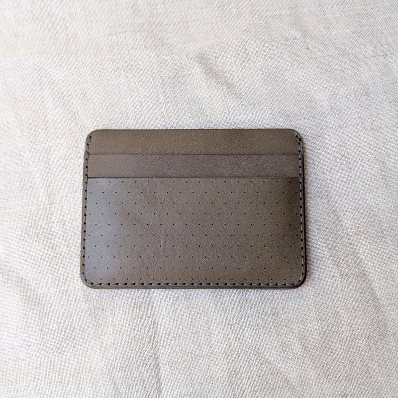 Brown leather cardholder on a light gray fabric background

Wooly Made cardholder handmade leather small wallet sowa boston small business gift shop boutique gifts for him unisex