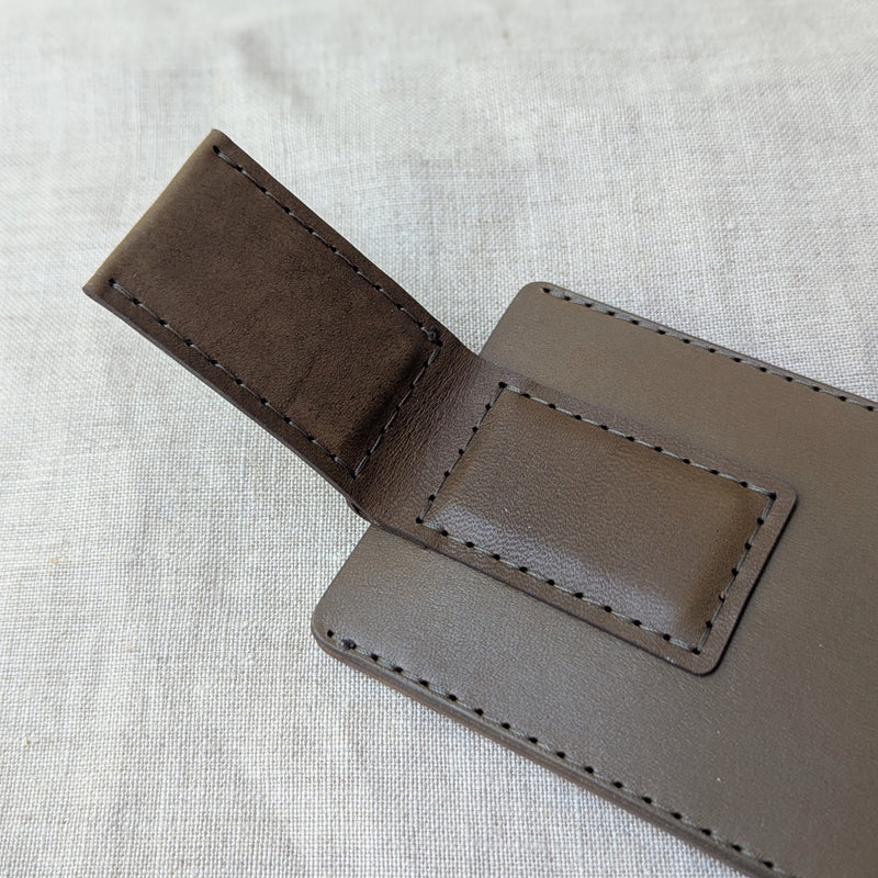 Brown leather wallet on a light gray fabric background

woolly made unisex men's cardholder money clip magnet leather wallet shop boston gift store sowa boutique