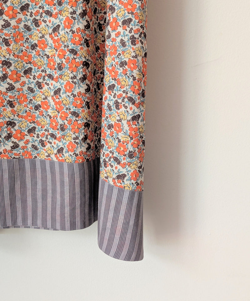 Close-up of a floral dress with a striped trim on a plain background

Domi slip dress nightgown organic cotton pjs pajamas sleepwear loungewear shop boston sowa boutique store gift
                                                                                             