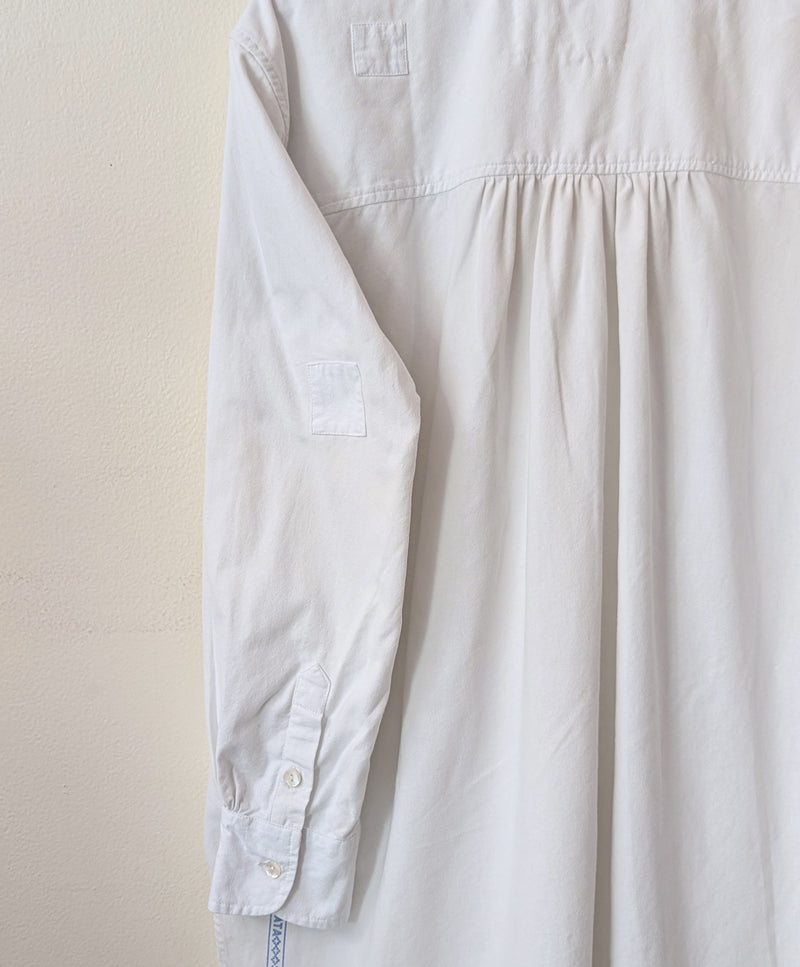 Light-colored shirt on a beige background

Auntie Oti button down cotton oversized upcycled shirt sowa boston small business gift shop boutique