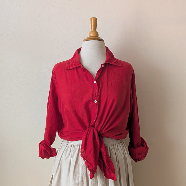 Red blouse on a mannequin against a plain background

Auntie Oti button down khadi cotton lightweight shirt sowa boston small business gift shop boutique
