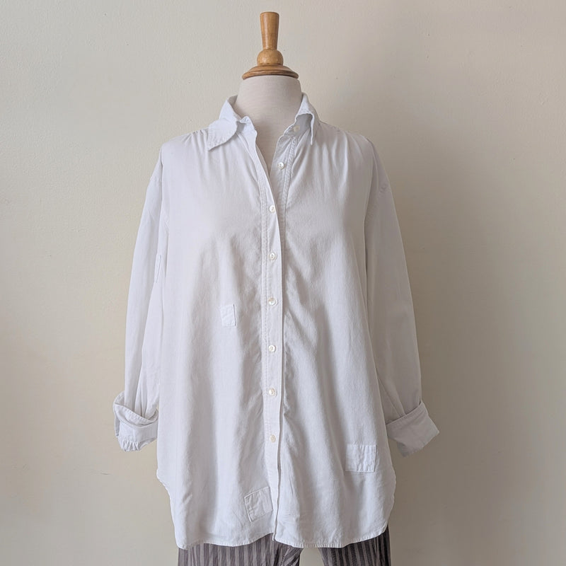 White shirt on a mannequin against a plain background

Auntie Oti button down cotton oversized upcycled shirt sowa boston small business gift shop boutique