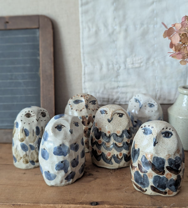 Set of ceramic owl figurines on a wooden surface with a neutral background

Charlotte Salt handmade and hand-painted ceramic animal sculptures figurines sowa Boston small business gift shop boutique store