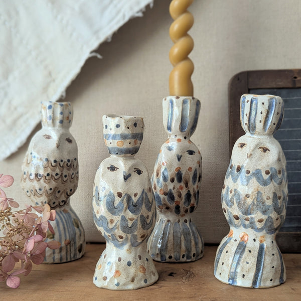 Set of ceramic owl-shaped candle holders on a wooden surface with a neutral background.

Handmade and hand-painted owl candle candlestick holder ceramic clay pinched sculptures by Charlotte salt small business sowa Boston gift shop boutique store