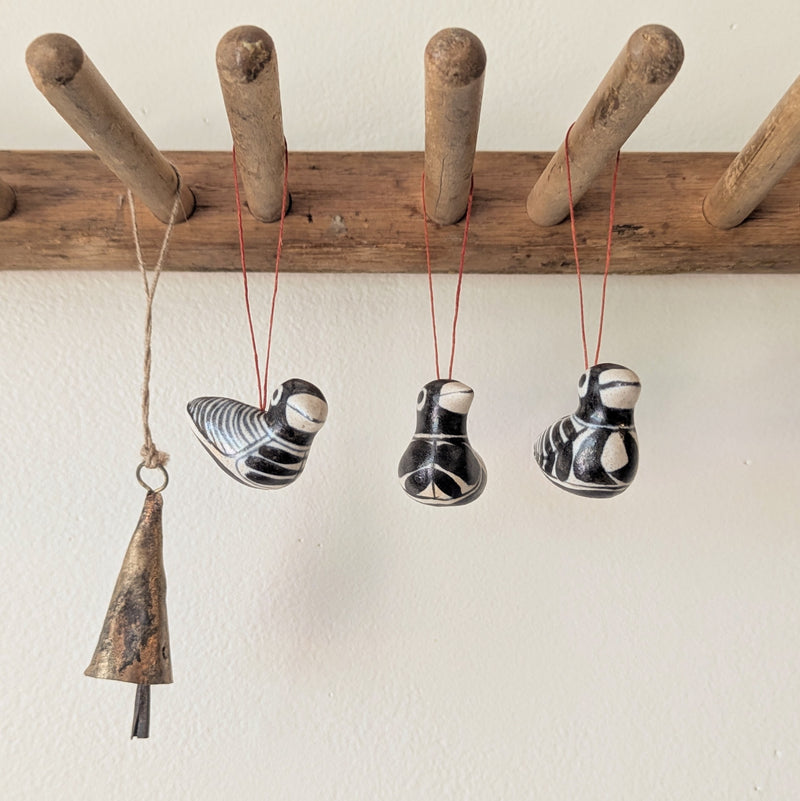 Decorative hanging ceramic birds on a wooden rod against a white wall

Anna Hepler clar ceramic bird ornaments holiday figurines handmade hand painted New England Boston Massachusetts sowa gift shop store boutique