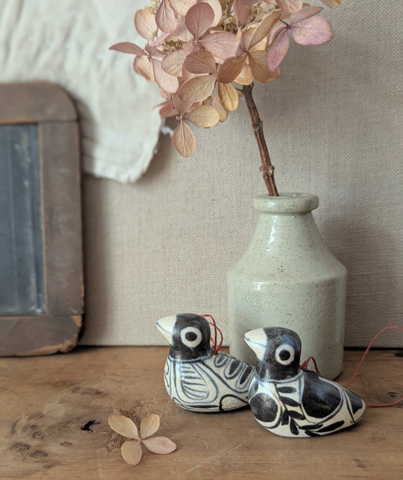 Two ceramic birds and a vase on a wooden surface with a neutral background

Anna Hepler clar ceramic bird ornaments holiday figurines handmade hand painted New England Boston Massachusetts sowa gift shop store boutique