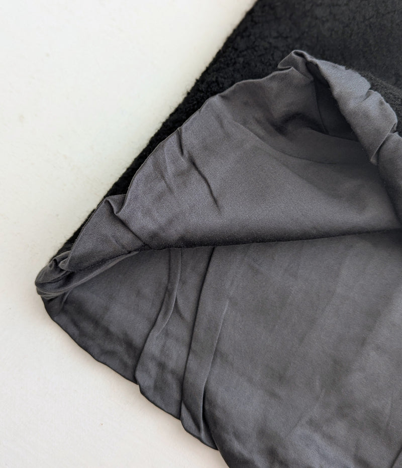 interior of a wool silk lined vest against white background