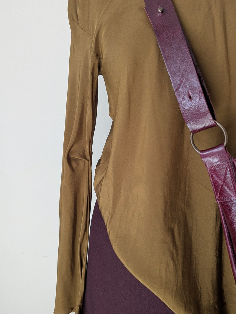 Tobacco brown draped silk blouse and maroon wool skirt from Susanne Bommer on a mannequin with a red Stitch & Tickle bag