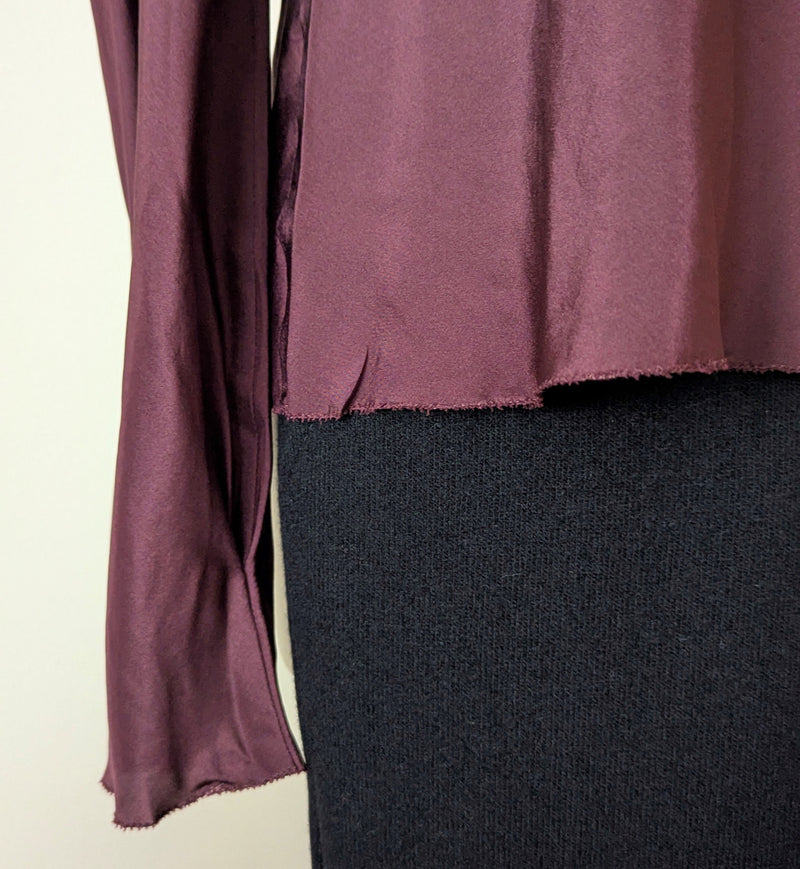Susanne Bommer silk puff shoulder bordeaux long-sleeve top on a mannequin