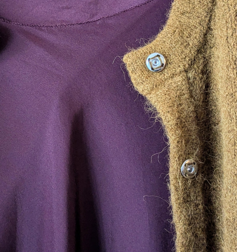 Susanne Bommer silk puff shoulder bordeaux long-sleeve top and tobacco brown pullover cadigan close-up shot
