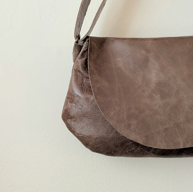 Stitch and Tickle Passito bag in Chai  on a light beige background