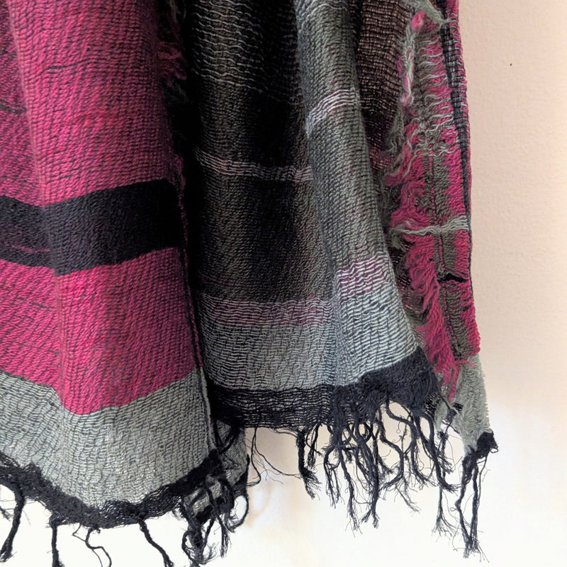 Scarf with pink, black, and gray colors on a light background