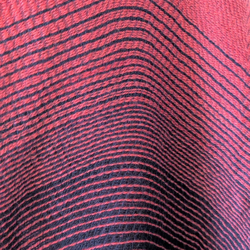 Close-up of red and black striped fabric texture