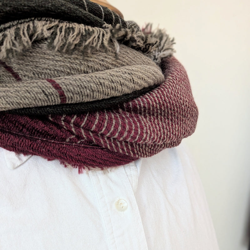 Patterned scarf in brown and red on a white background