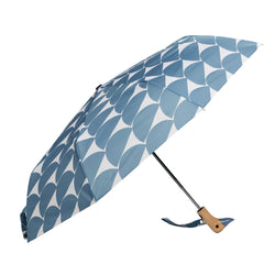 Umbrella with blue half circle pattern with duck head handle against a matching background