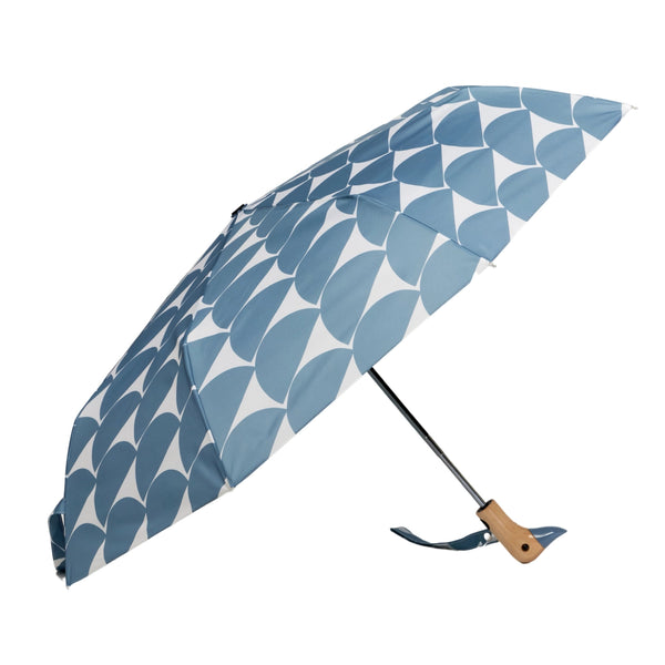 Umbrella with blue half circle pattern with duck head handle against a matching background