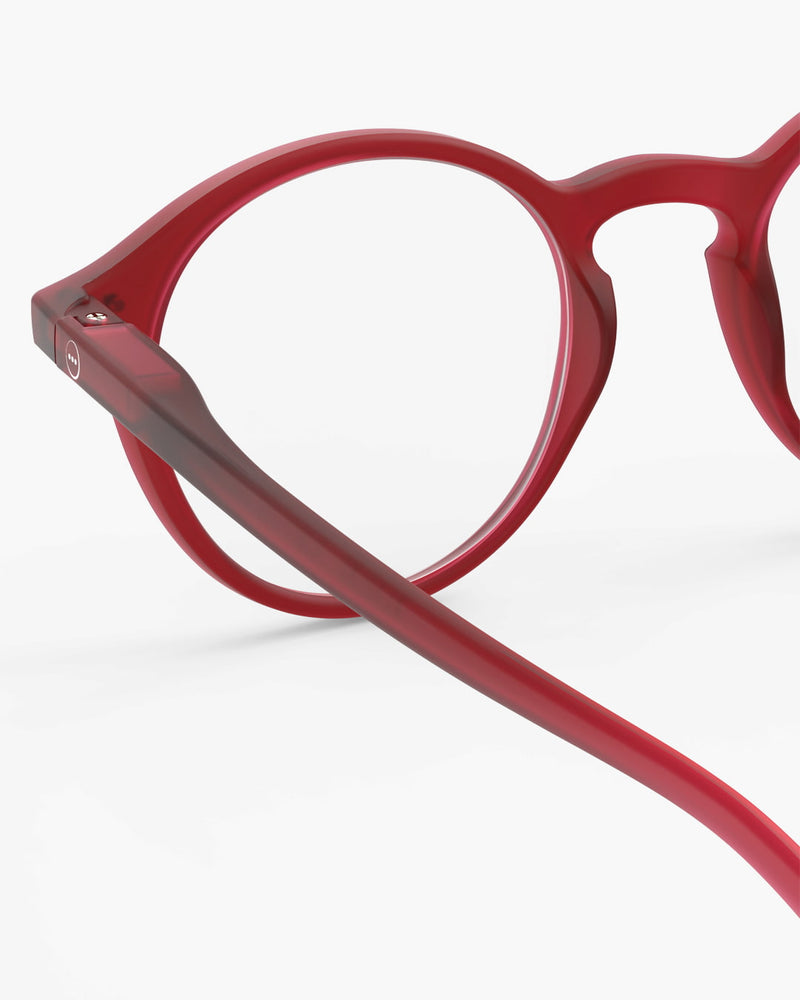 Red eyeglasses on a white background