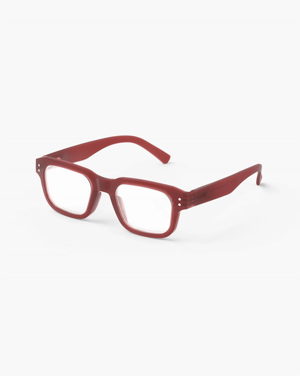 Red eyeglasses on a white background